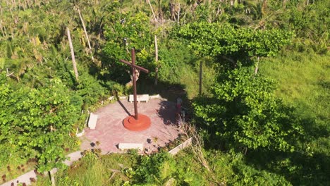 group of sightseers visiting the historical cross in limawasa island, southern leyte, philippines