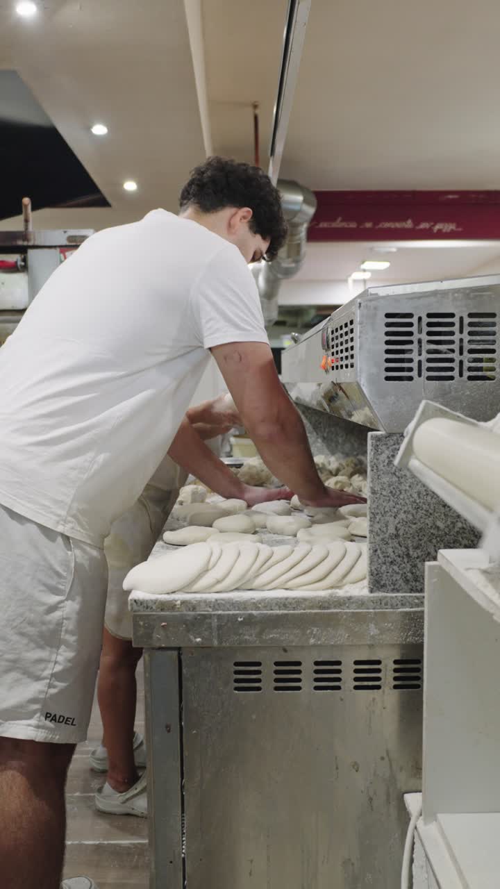 Bakers preparing dough in a bakery