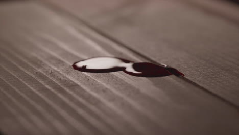 blood spatter on wooden surface. closeup