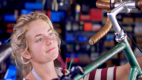 woman repairing cycle at workshop 4k