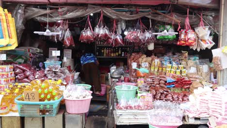 customers and vendor interacting in a candy shop.