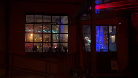 people dancing trough the window