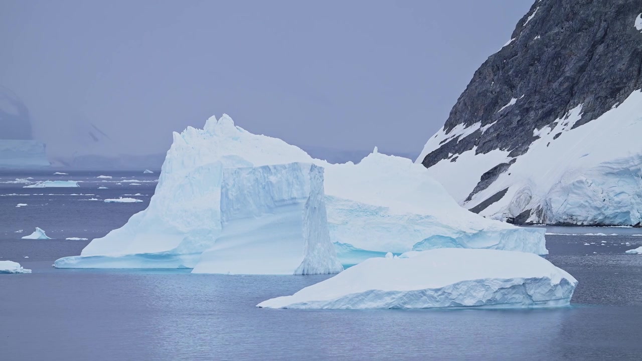 Antarctica Scenery of Icebergs and Ice on Antarctic Peninsula in Vast Dramatic Landscape, Beautiful Seascape with Big Unusual Shapes in Blue Winter Coastal Scene