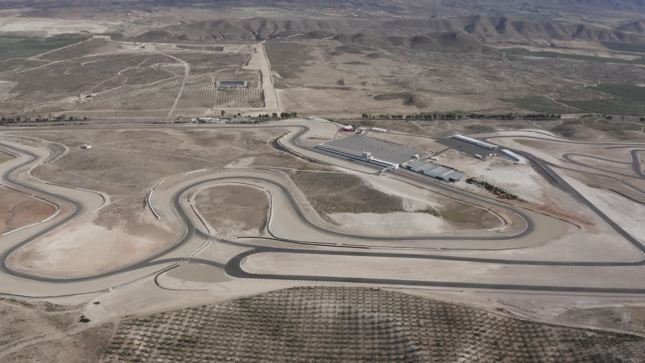 A birds eye view over Almeria race track in southern Spain, dusty mountainous terrain