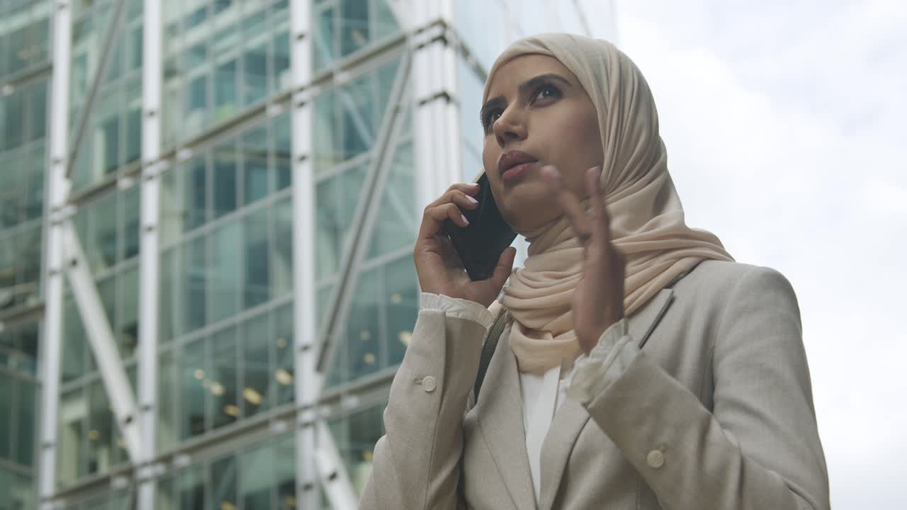 Muslim Businesswoman On Mobile Phone Standing Outside Office In City 5