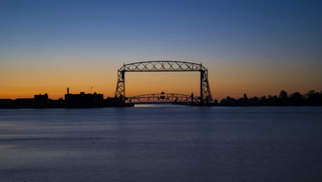 sunrise timelapse of duluth lift bridge on lake superior in minnesota