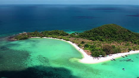 tropical island aerial view. camera flies over the shore and the beach of the tropical island