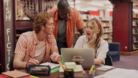 students collaborating in library