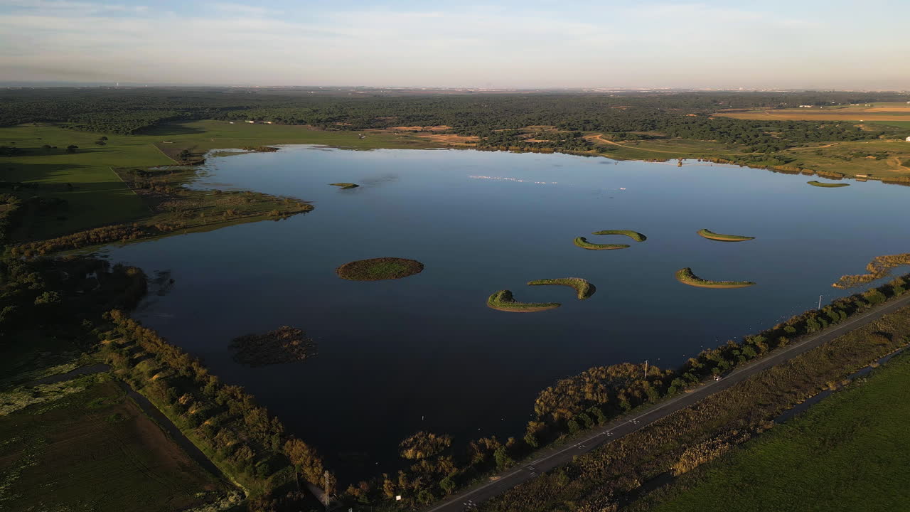 Beautiful lake with moon-shaped islands inside, aerial view