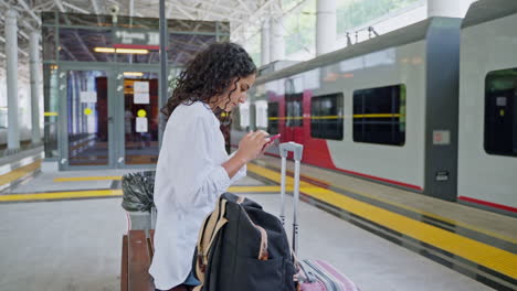 woman waiting at train station