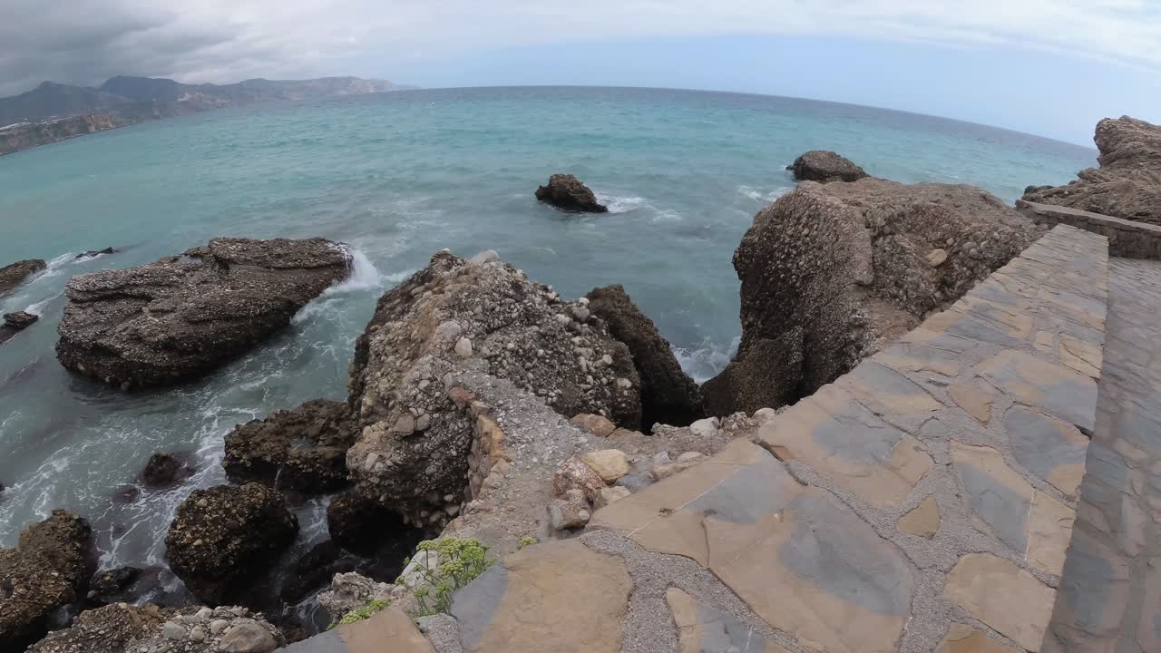 playa españa malaga nerja en un día nublado de verano usando un dron y una cámara de acción estabilizada-9