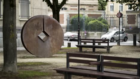 urban park sculpture with benches