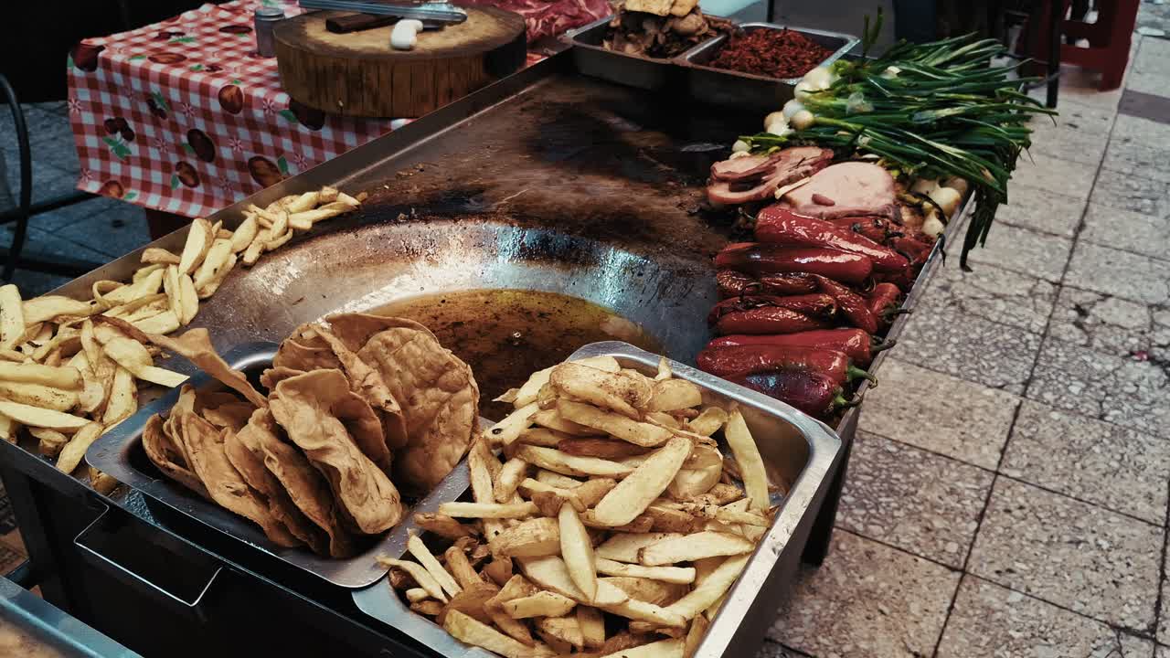 Street food grill with various dishes