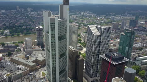 AERIAL:-Spectacular-View-over-Frankfurt-am-Main,-Germany-Skyline-Skyscraper-Roofs-on-Cloudy-Overcast-Day