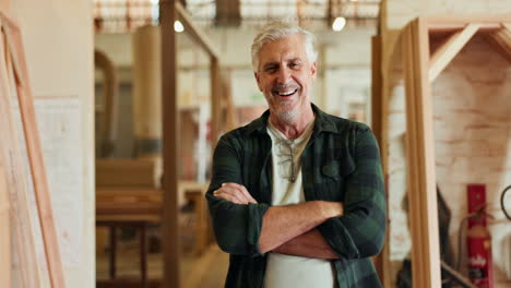 portrait of a smiling carpenter in his workshop