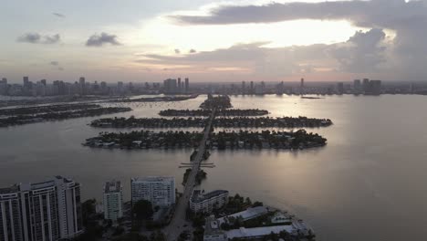 long colorful sunset aerial along venetian islands to edgewater miami