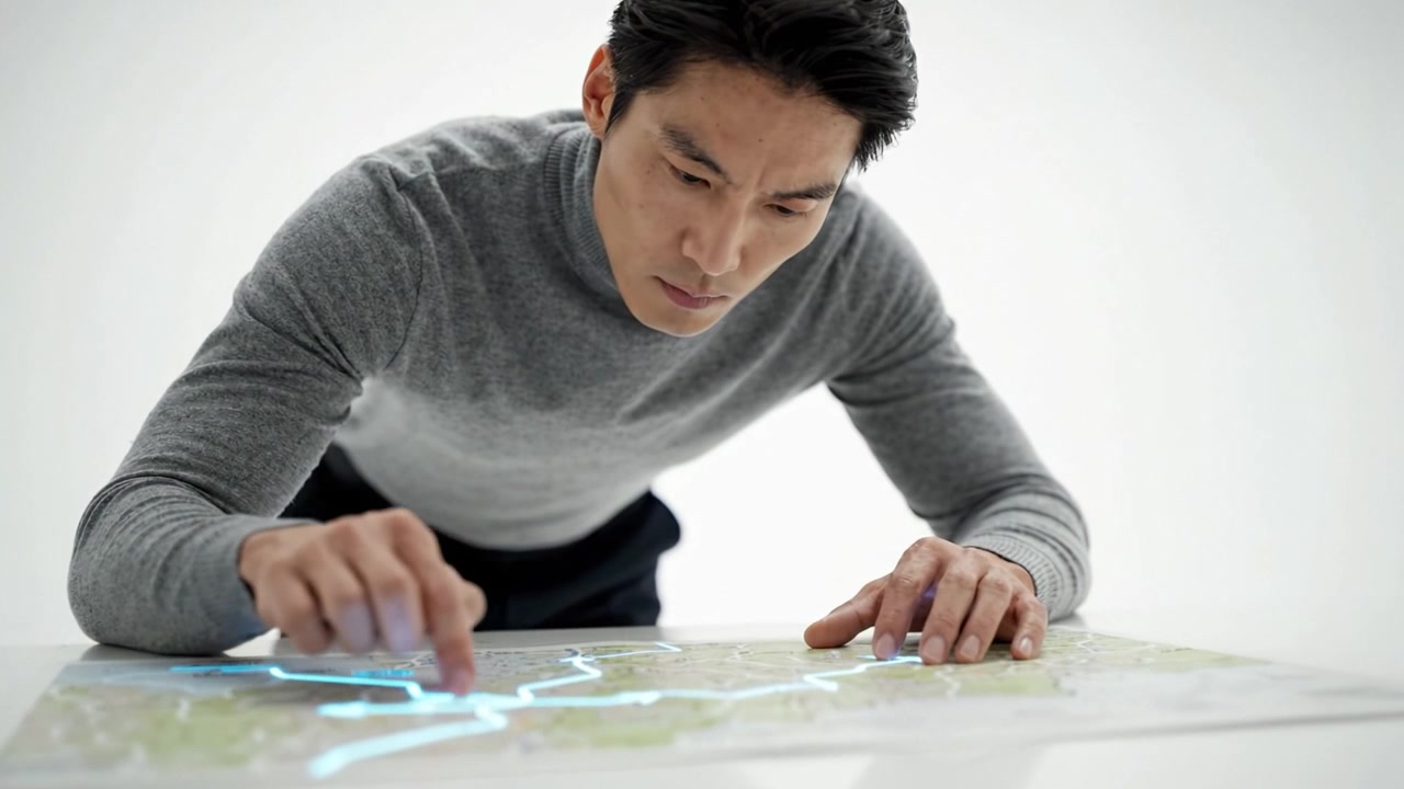 現代的な設定で、詳細な地図を注意深く調べ、ルートと場所をたどる集中した個人。探求と旅の計画を強調する。