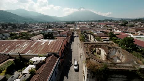aerial fpv shot of arch street of antigua guatemala