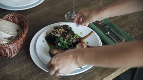 serving lamb chops with black risotto