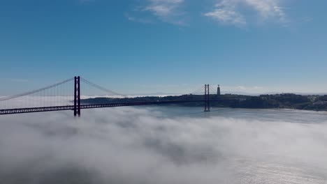 drone shot of the fog over the river in lisbon.
