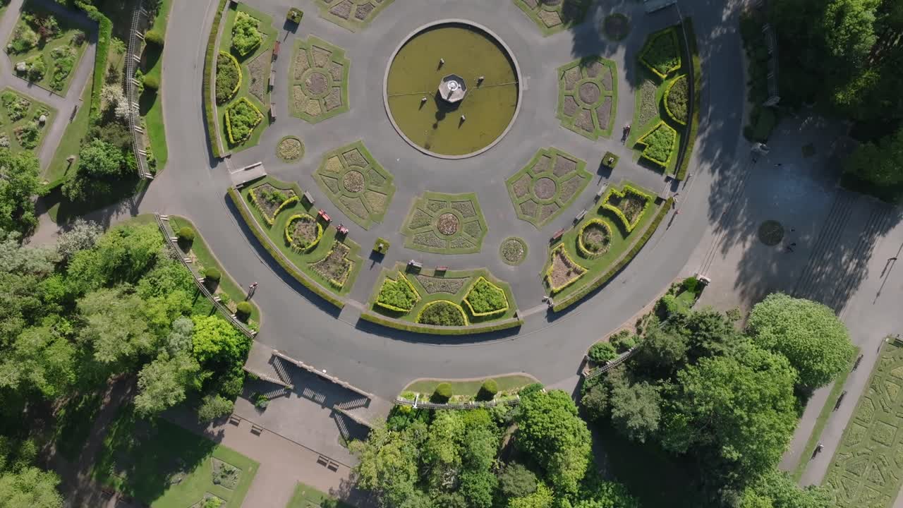 Italian style gardens with green trees. Top down flyover. Stanley Park, Blackpool, Lancashire, UK.