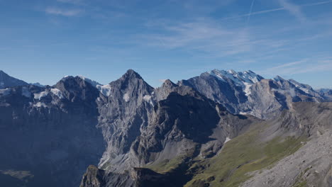 the expansive view embracing the towering mountain landscape presents a truly cinematic spectacle, with a spectacular sky towering above them