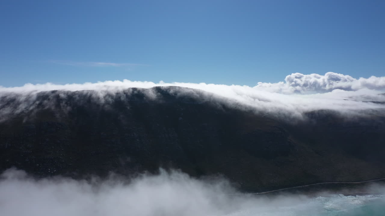 Sea of clouds over a mountain in South Africa aerial sunny day