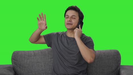 Happy-Indian-man-talking-on-phone-Green-screen