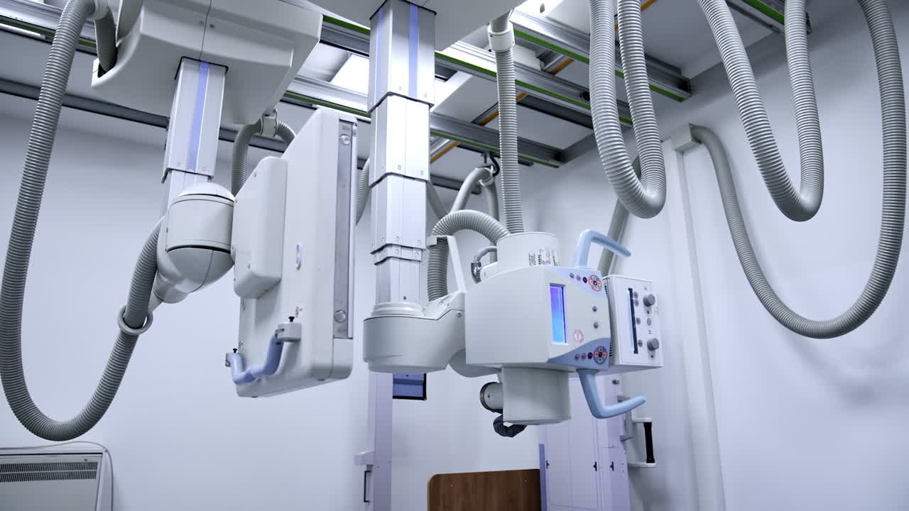 Advanced x-ray equipment in the modern hospital. Panning view of x-ray scan hanging on the ceiling of the radiology room. Low angle view.