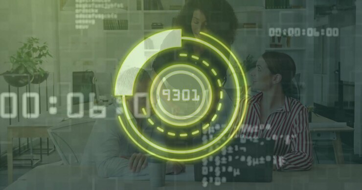 Data graphic updating live above laptop urging colleagues typing and reviewing business data