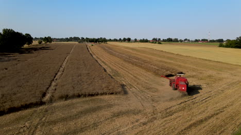 point-of-interest-view-of-a-combine-harvester-at-work-collecting-barley