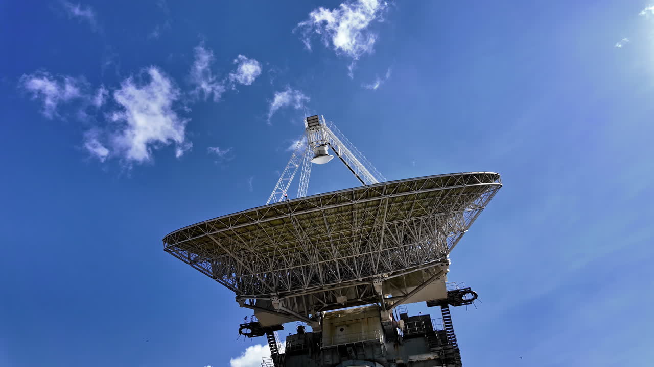 Large Satellite Dish Under Blue Sky