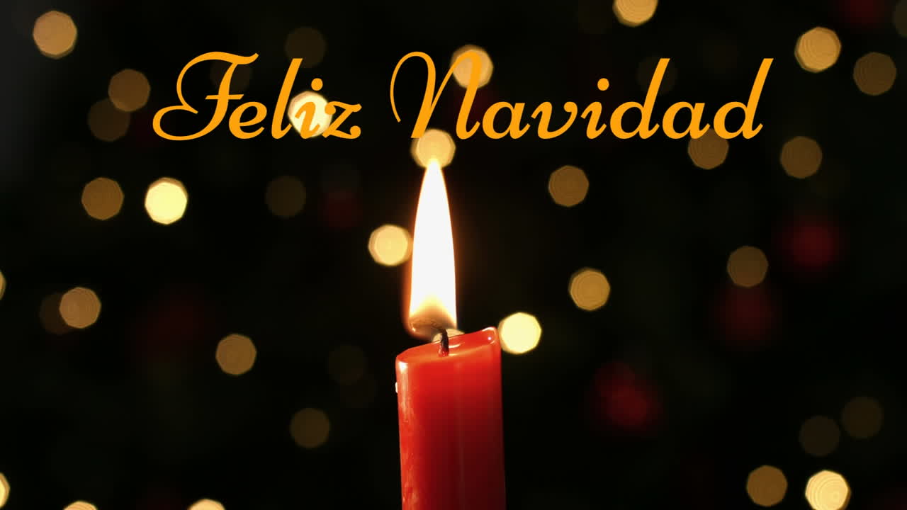 feliz navidad escrito sobre una vela encendida