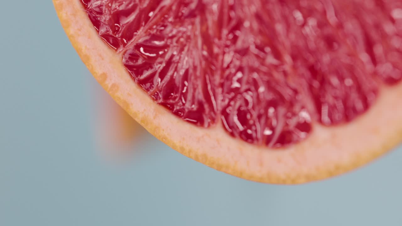 Vertikal video av en nærbilde makro grapefrukt til bakgrunn