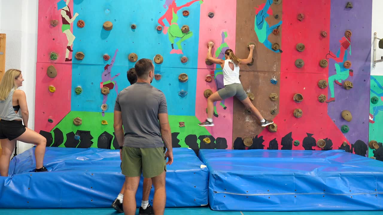 People climbing on an indoor climbing wall