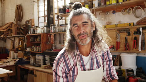 attractive carpenter smiling while working