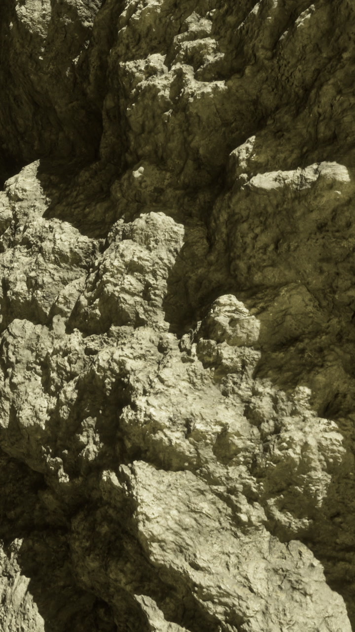 Natural rock formations showcase intricate textures and earthy colors at sunset