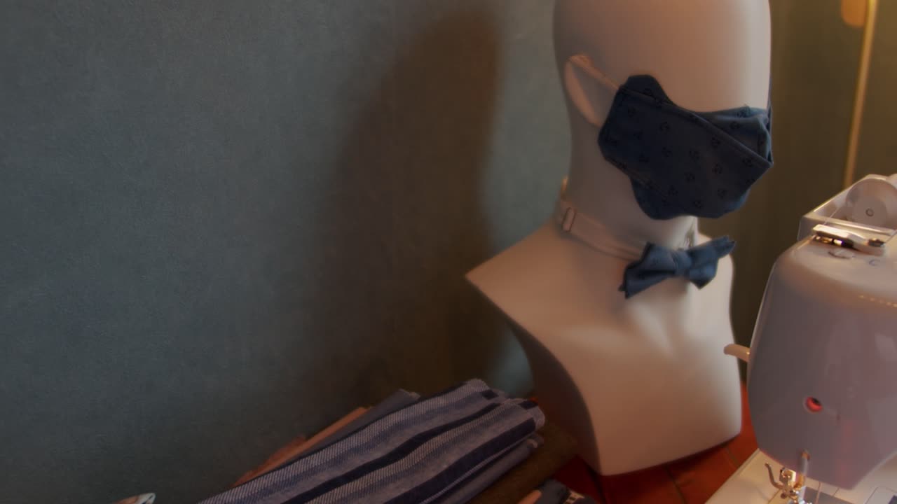 Workshop of tailor with mannequin in slow motion.