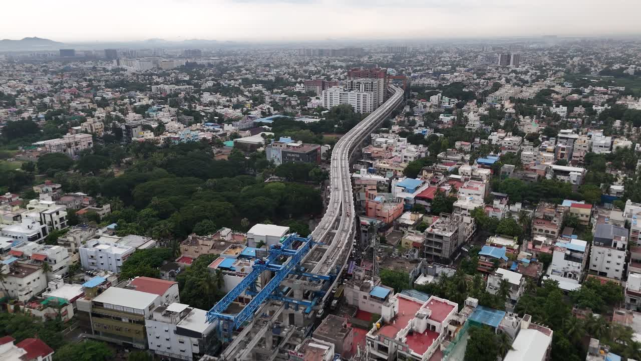 High-angle footage South Indian City. The videos capture the sprawling city from day to night, showcasing active construction, vibrant streets, and a blend of old and new architecture