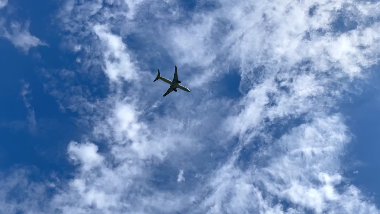 Landing of an airplane flying overhead.