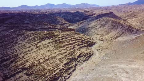 Aerial-over-rugged-desert-landscape-and-unique-geology-in-Namibia-Africa