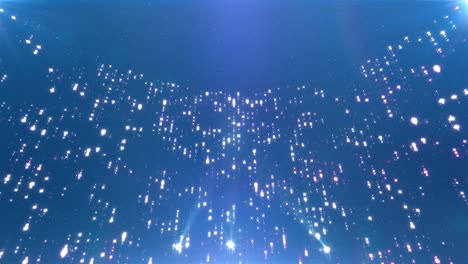 blue light particles background with projectors lights. elegant awards ceremony or fashion show background for stage. glitter particles vj seamless loop footage. oscar or grammy style