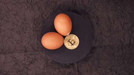 topdown view of eggs and bitcoin coin. - high angle shot