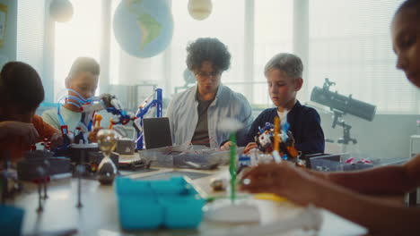 children learning robotics in a classroom