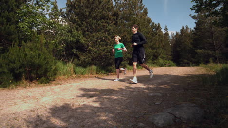 athletic couple jogging through the countryside