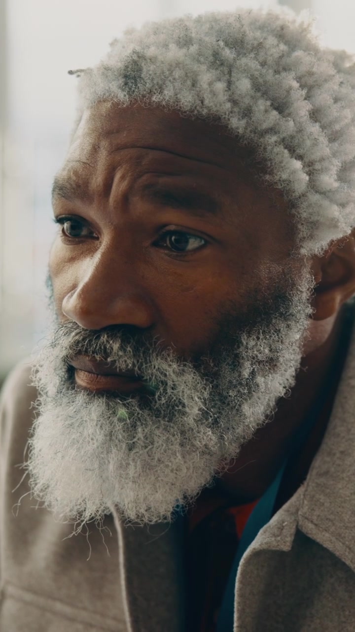 Close-up Portrait of a Thoughtful Mature Man with a White Beard