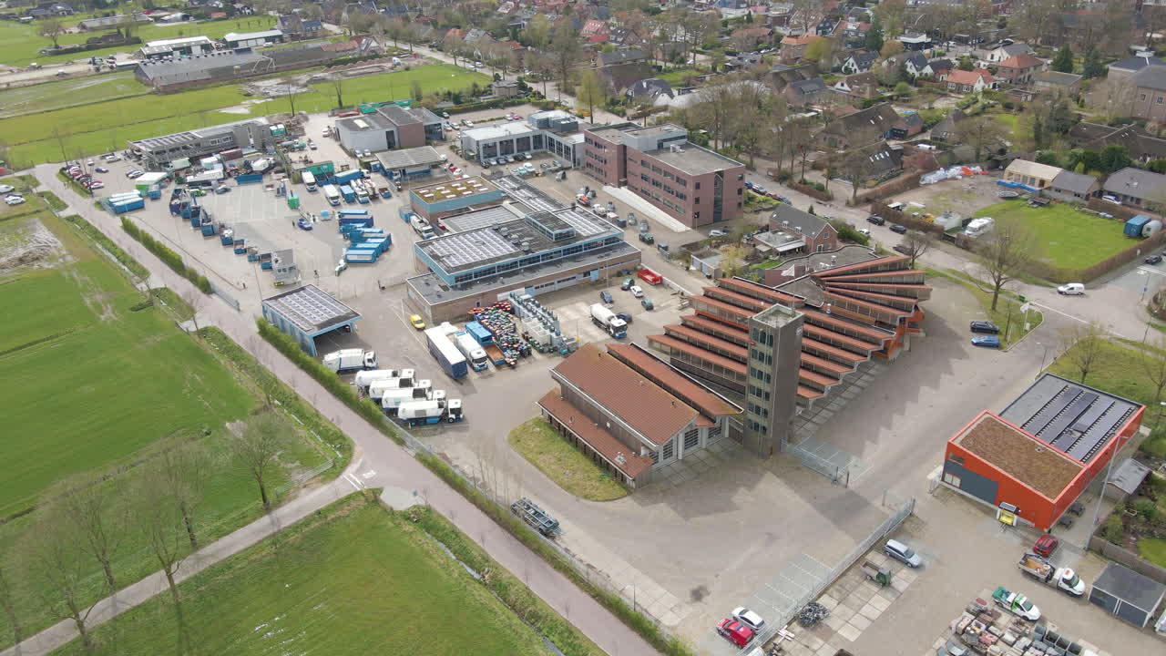 Aerial of garbage trucks on terrain of recycling station