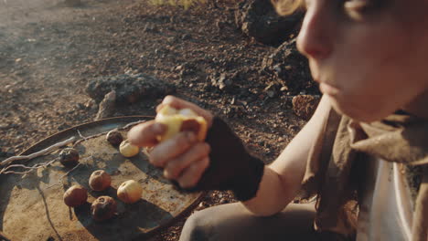 woman in eating rotten apples in dystopian world