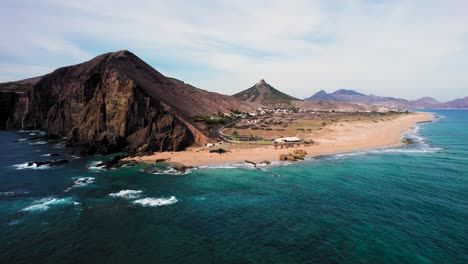 receding aerial movement about the endpoint of ponta da calheta at porto santo island, portugal