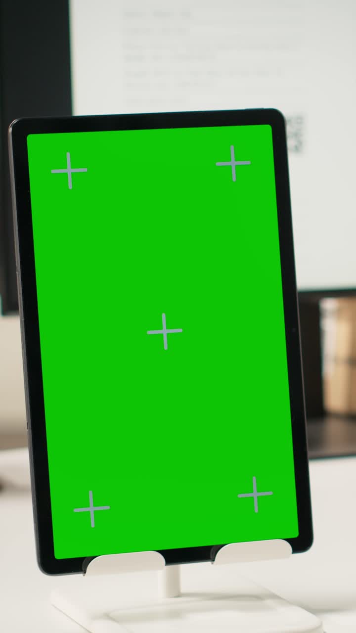 Vertical Video Black employee with hard hat manages tracking info next to mockup display